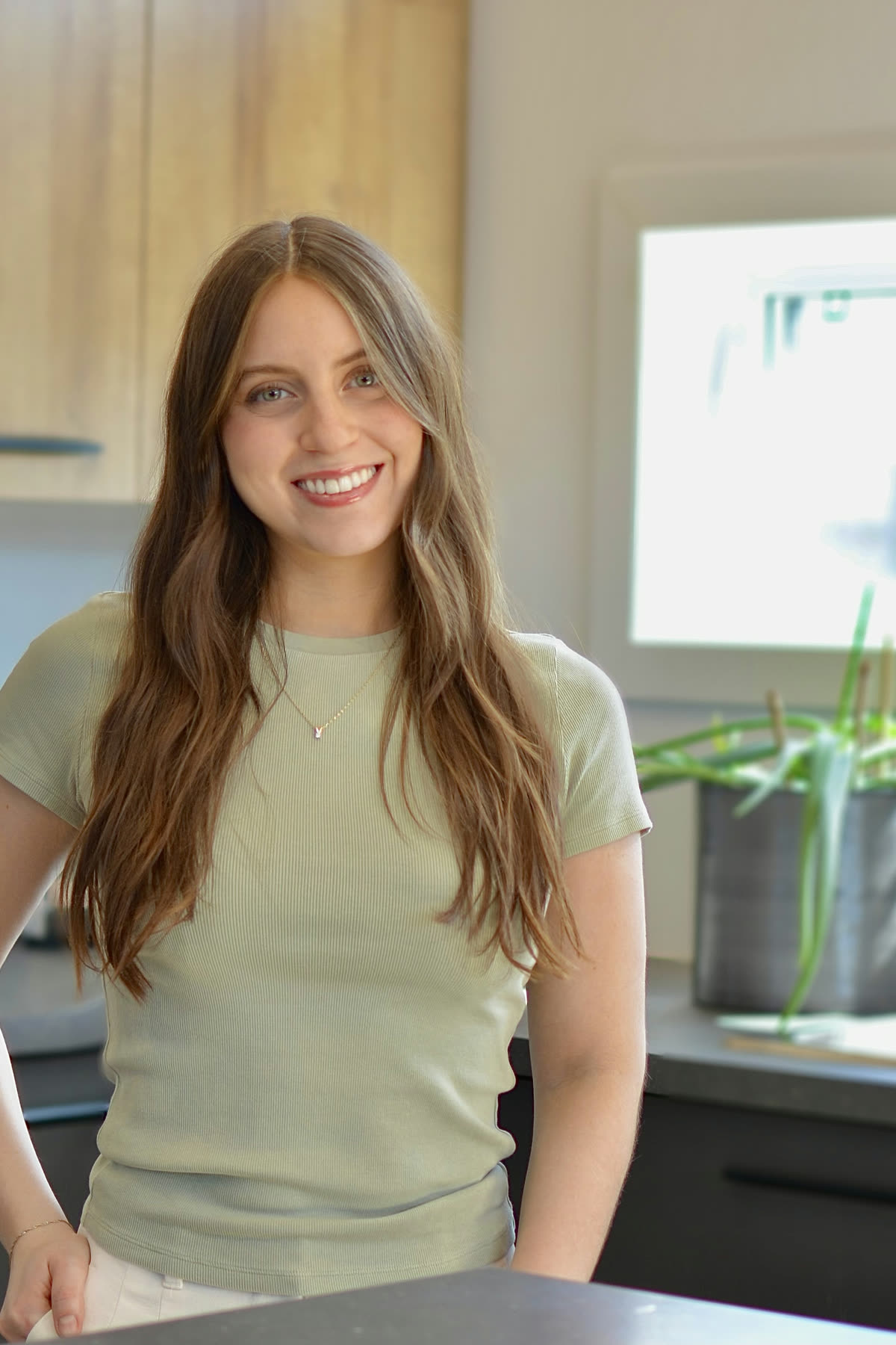 Martina, Registered Dietitian-Nutritionist, smiling in a bright kitchen