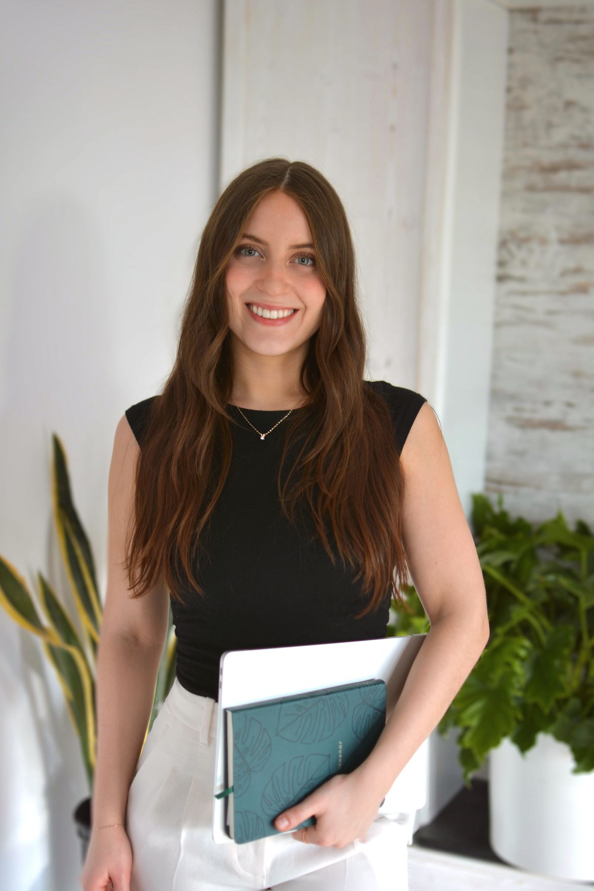 Martina-Grace De Bonis, Registered Dietitian-Nutritionist, smiling in her office